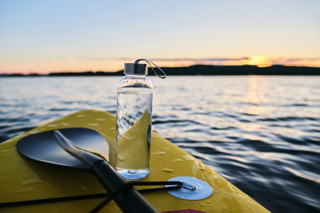 Clean water bottle on a paddleboard.